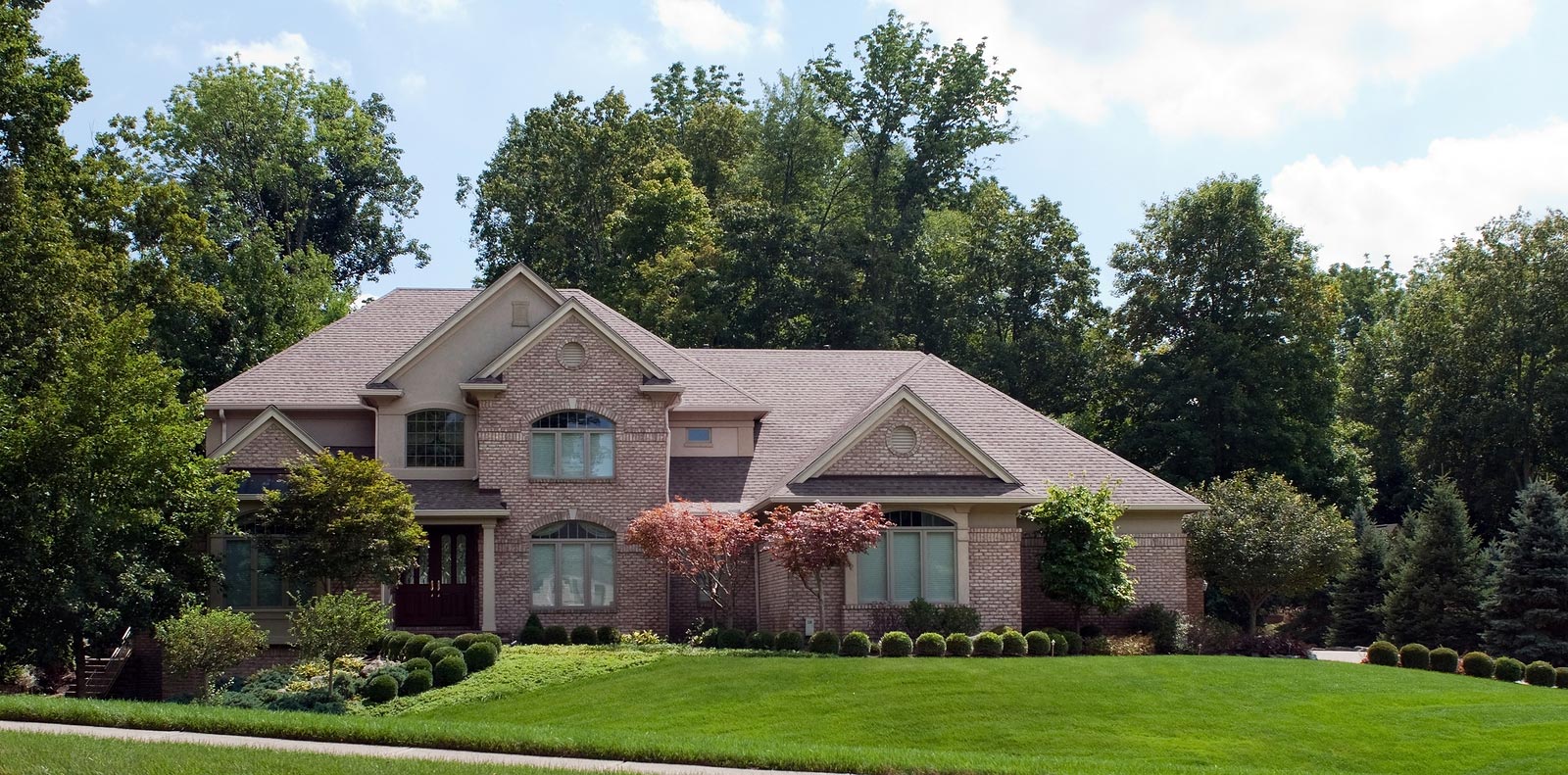 Nice landscaping and lawn of lovely home